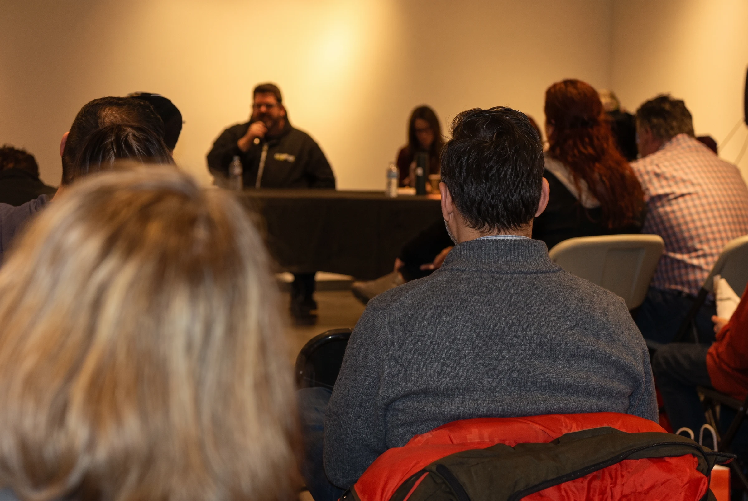 Community members listening to a HeadCase panel discussion